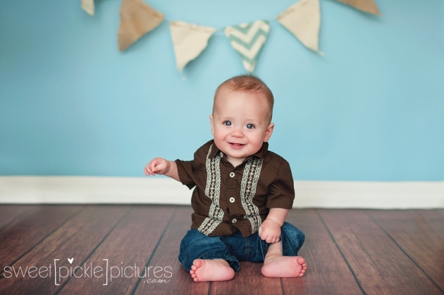 6 month old milestone studio session with bunting